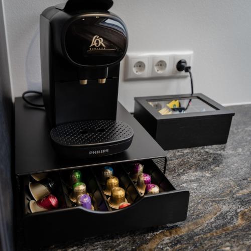 a black box filled with different types of chocolates at Arnestgut in Strobl
