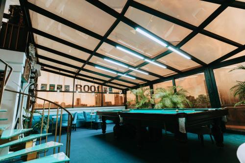 a pool room with a pool table in a building at Hotel Old Town in Batumi