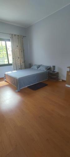 Ένα ή περισσότερα κρεβάτια σε δωμάτιο στο Maison Andon'ny Aina