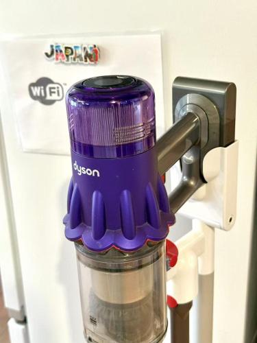 a purple blender sitting inside of a refrigerator at TOKYO HOSHI VILLIA-Private Villa in Tokyo ideal for groups and families in Tokyo