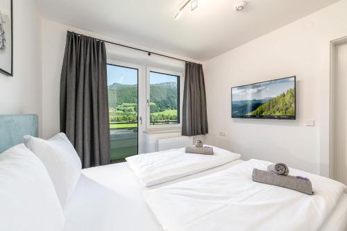 Ένα ή περισσότερα κρεβάτια σε δωμάτιο στο Mountain Love Appartements - by myNests