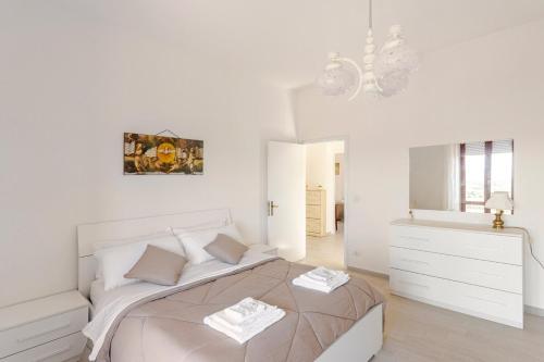 Una cama o camas en una habitación de I Due Gelsi appartamento Wood