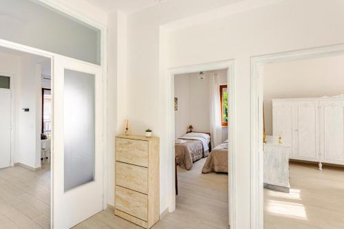Una cama o camas en una habitación de I Due Gelsi appartamento Wood