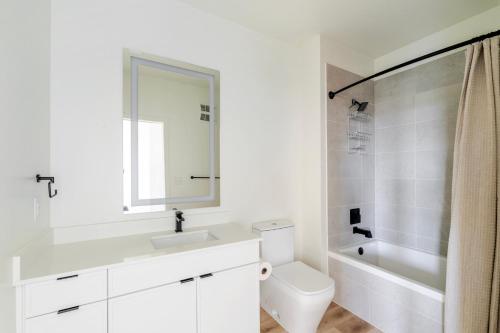 a white bathroom with a sink and a toilet at Blueground Round Rock pool nr Old Settlers Park ATX-318 in Austin