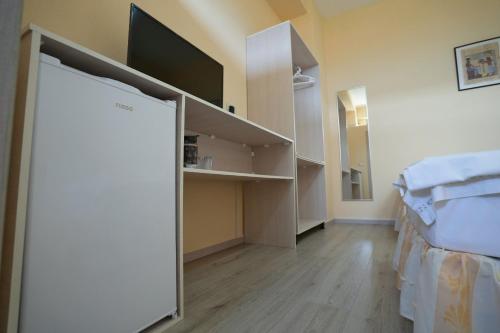 Ένα ή περισσότερα κρεβάτια σε δωμάτιο στο Vila Nisajos