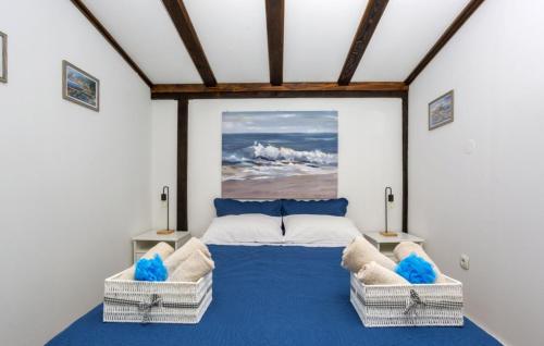 a bedroom with a large bed with two chairs at Casa Silente Opatija by Villas Guide in Lovran