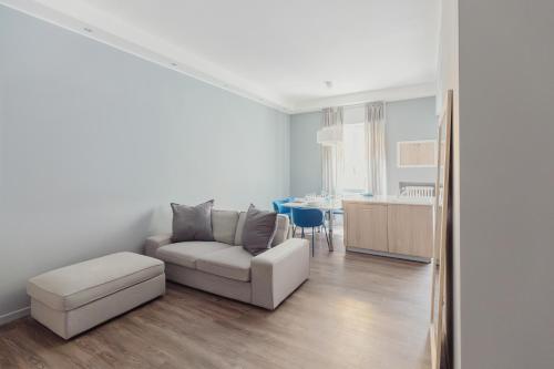 a living room with a couch and a table at GoHost - Cozy and Spacious Flat in City Life in Milan