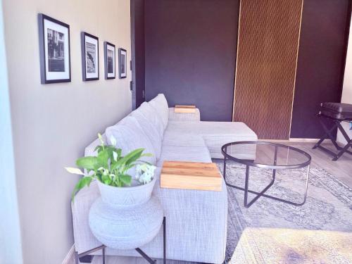 a living room with a couch and a table at NO4 Lilliput - Sandton Executive Guest House - OPENING SPECIAL in Sandton