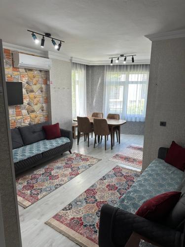 a living room with a couch and a table at Alha apart otel in Istanbul