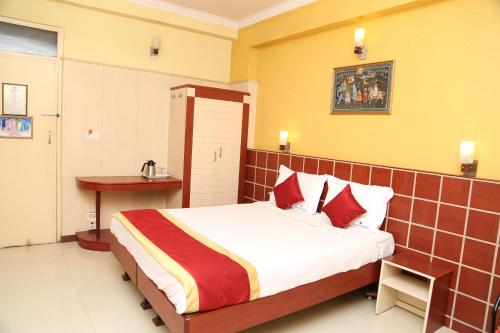 Ліжко або ліжка в номері Hotel Anand Regency