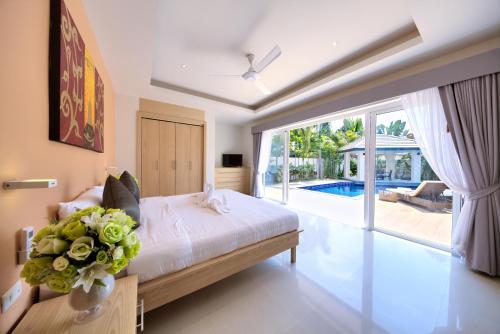 Foto da galeria de BAAN RIM TALAY - Beach Side 2 Bed Pool Villa em Nathon