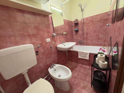 a bathroom with a toilet and a sink at Sussurro del Lago - A due passi dal Traghetto in Tremezzo