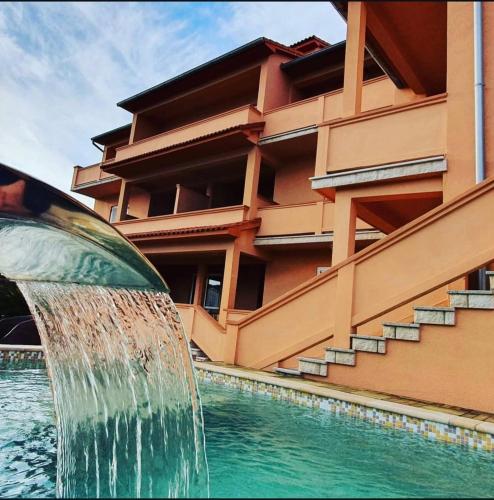 a water fountain in front of a building at Del Mar Rab in Kampor