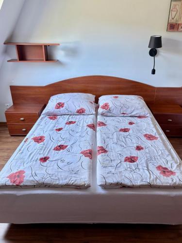 a bed with a blanket on top of it at Camping Morski 21 in Łeba
