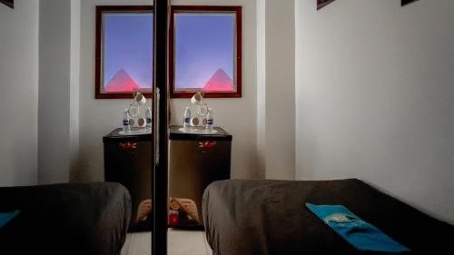 a corner of a room with a window and a couch at Luxury Panorama pyramids & jacuzzi in Cairo