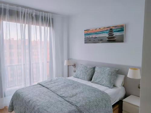Ένα ή περισσότερα κρεβάτια σε δωμάτιο στο Apartamento Luminoso 35N