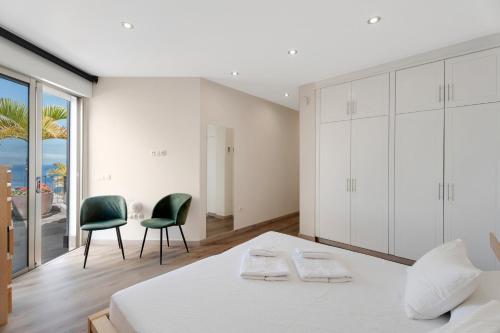 En eller flere senge i et værelse på Villa Arenas 3 Playa la Arena