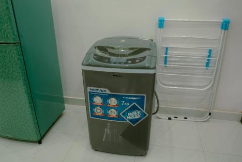 a trash can sitting next to a small refrigerator at Family-friendly Private Villa with Mountain Views near Kandy in Katugastota