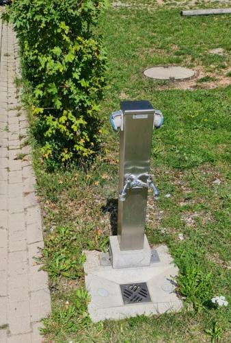 a statue of a fire hydrant in the grass at Sonnencamping Albstadt in Albstadt