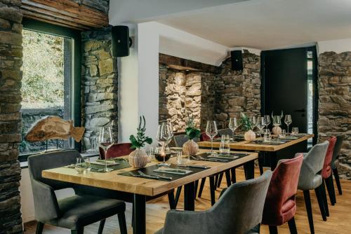 a dining room with a table and chairs at Hammesmühle Landgasthof in Mayen