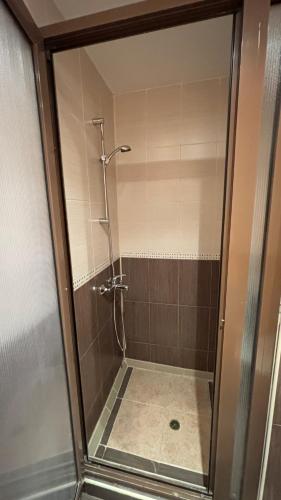 a shower with a glass door in a bathroom at Relax in Sunny Beach in Sunny Beach