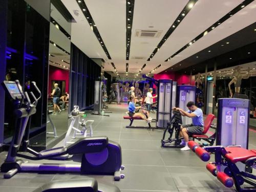 a gym with people exercising on treadmills and machines at STAR KLCC By Comfort Hospitality in Kuala Lumpur