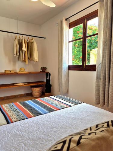 a bedroom with a bed and a window at Villa Florida in Motril