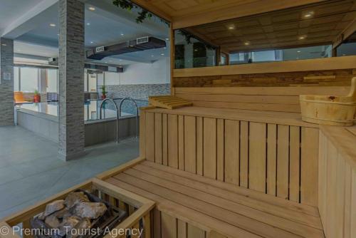 a hot tub in a house with a staircase at Hotel Central Vlasic in Vlasic