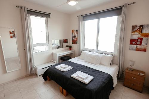 Ένα ή περισσότερα κρεβάτια σε δωμάτιο στο Leah's Deluxe Villa