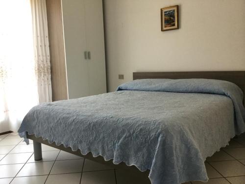 A bed or beds in a room at Hotel Bragozzo