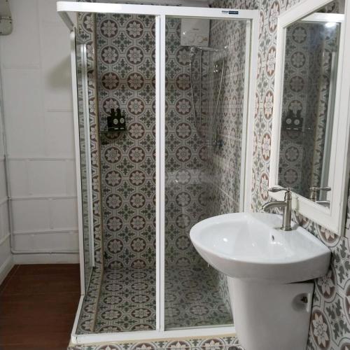 a bathroom with a shower and a sink at Aran hostel&Cafe Ngamwongwan in Ban Bang Khen (1)