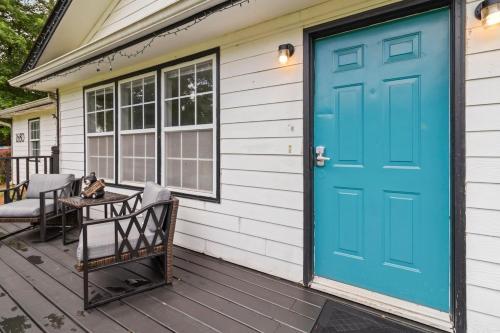 a front door of a house with a blue door at 5BR with Game Room & Huge Backyard in Lawrenceville