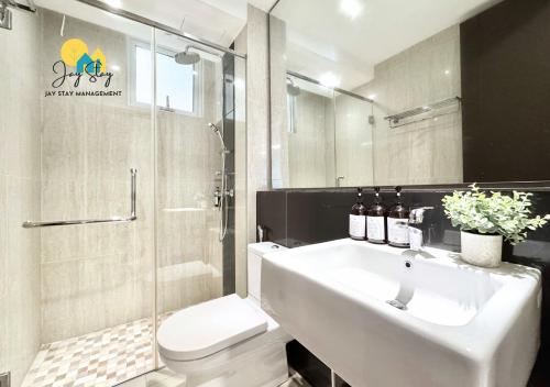 a bathroom with a sink and a toilet and a shower at The Shore l Luxury 3BR l 6-9pax l Direct Mall Access l City Centre l Melaka River l Jonker Street by Jay Stay Management in Melaka