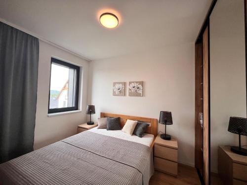 Postel nebo postele na pokoji v ubytování Residence Krušec
