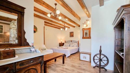 a living room with a bed in a room at Olimpia 3 in Novigrad Istria