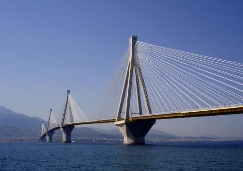 a bridge in the middle of the water at Hotel Antirriο in Antirrio