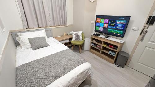 Postel nebo postele na pokoji v ubytování 182和光居--自助入住&加Line取得入住資訊