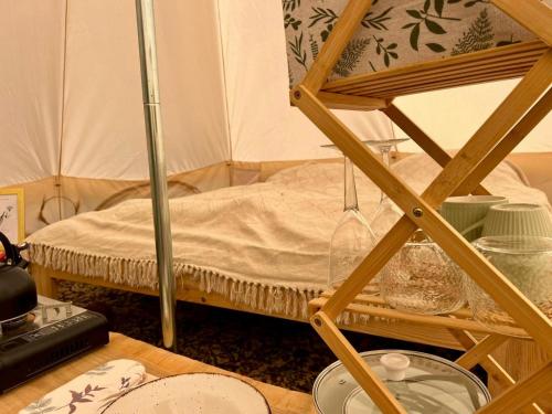 a small room with a bed in a tent at Krondorf and Spa Theodor 