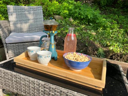 a table with a bowl of popcorn and a vase at Krondorf and Spa Theodor 