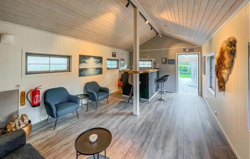 a living room with a couch and chairs and a table at Lovely Home In Flekkefjord With Sauna in Flekkefjord