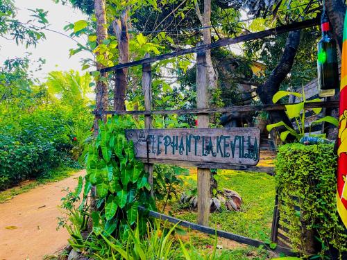 a sign that is on the side of a road at Elephant Lake Villa, Yoga & Meditation Sanctuary in Sigiriya