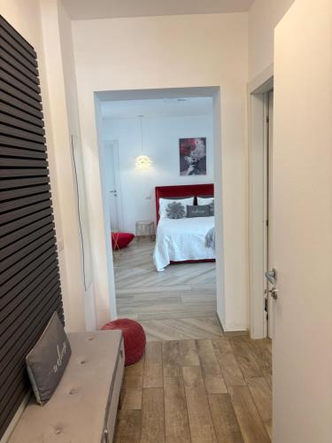a bedroom with a bed in the middle of a room at IVY PARK in Medolla