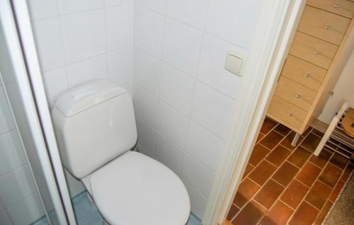 a bathroom with a white toilet in a room at Nice Home In Åkersberga With Wifi in Åkersberga
