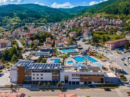 an aerial view of a resort with a swimming pool at Парк Хотел Модър in Devin