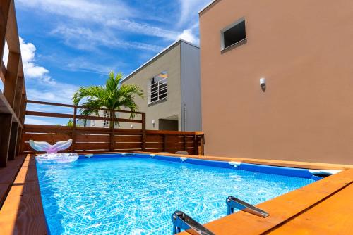 a swimming pool in the middle of a house at Belle Jung Villa Onna in Onna