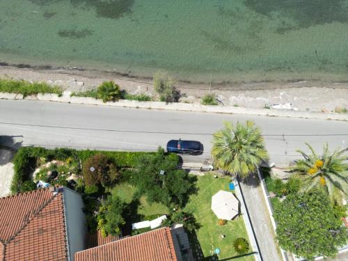an aerial view of a road and a street with a car at Sunset Oasis in Roitika