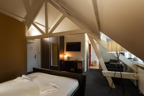 Postel nebo postele na pokoji v ubytování Hotel Orion