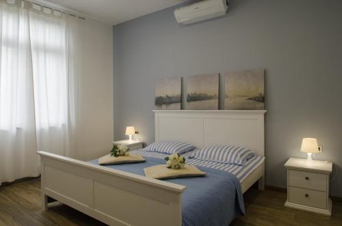 a bedroom with a bed with two pillows on it at Luxury Istrian Apartment ZP in Marčana