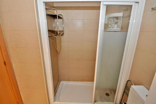 a shower with a glass door in a bathroom at Apartment Verano Go2lloret in Lloret de Mar