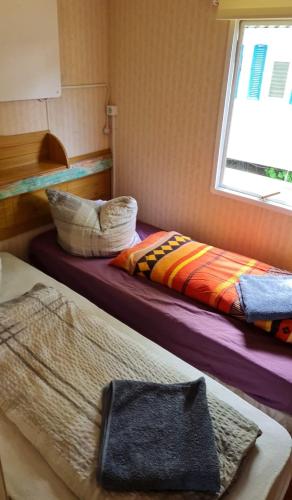 Postel nebo postele na pokoji v ubytování Ferienpark am Hellsee
